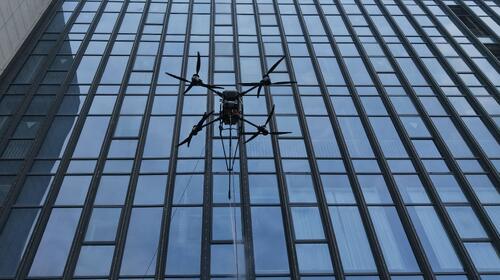 Latest company news about Technological drive innovation: MYUAV double tethered high altitude cleaning UAV standardized cleaning Jiaxing Gymnasium